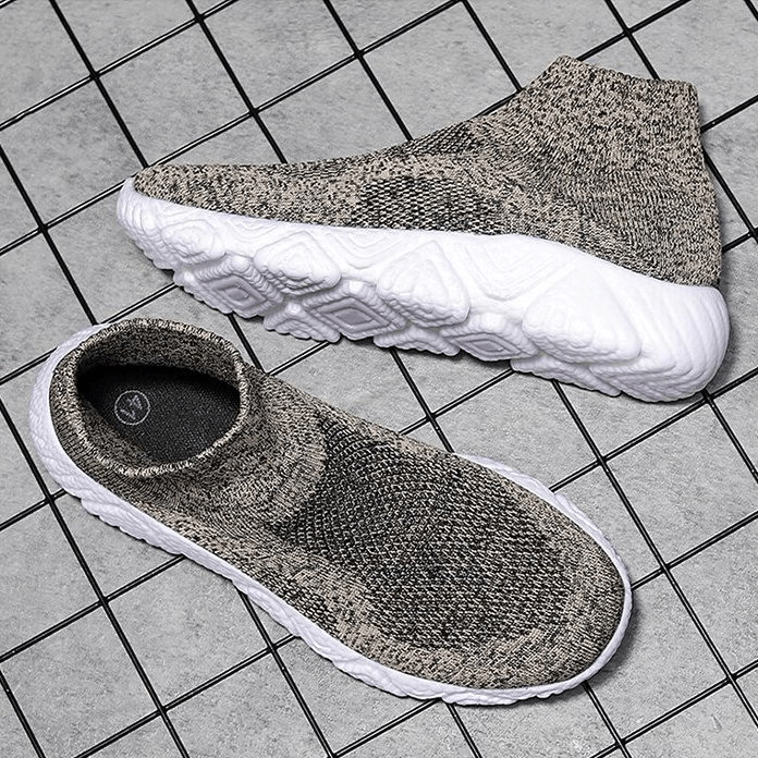 Mesh elastic breathable unisex sneakers SF1215, gray slip-on style with white cushioning sole on a tiled background.