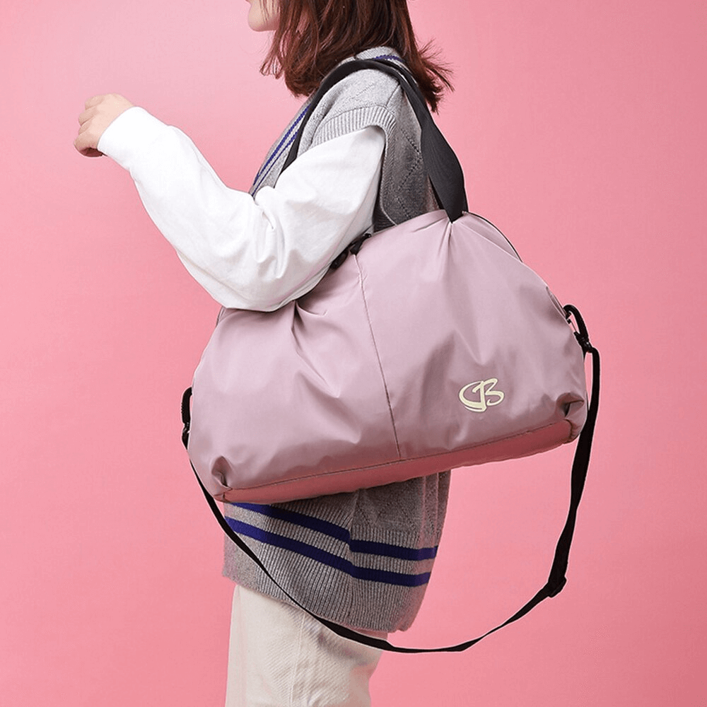 Stylish woman carrying pink multifunction waterproof large capacity gym bag, perfect for sports and travel adventures.