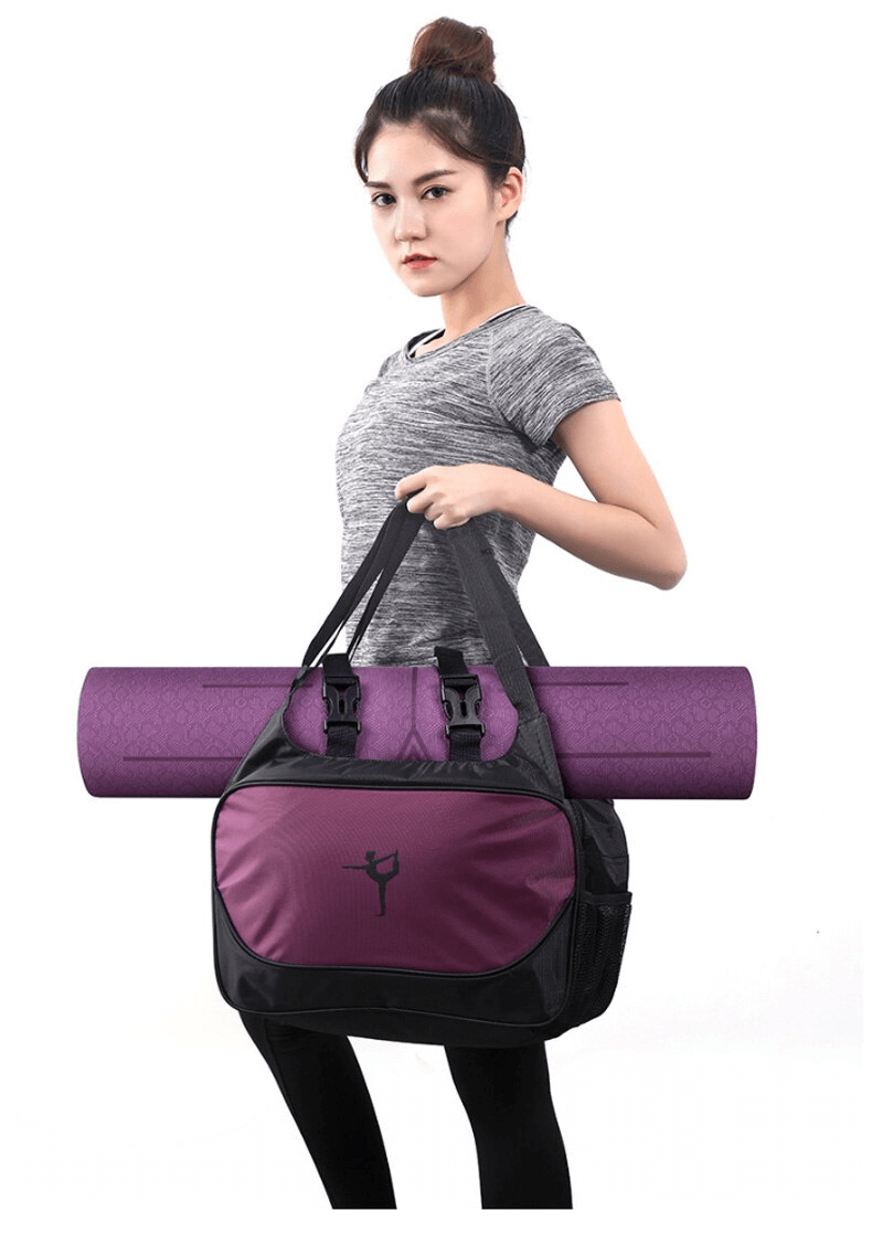 Woman holding a waterproof sport bag with a purple mat secured, designed for fitness and travel.