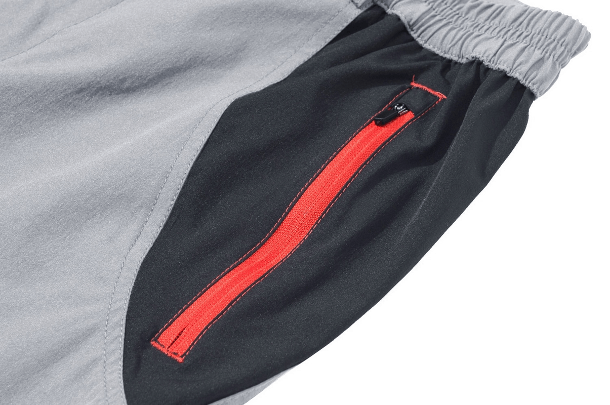 Close-up of no fleece lined waterproof pants for men showing a red zipper pocket detail on straight hiking trousers.