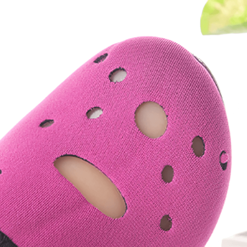 Close-up of pink non-slip beach shoe with breathable holes for diving and water sports.