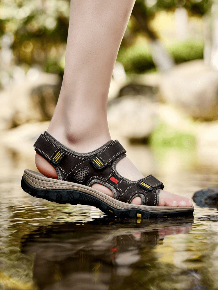 Open Toe Tactical Leather Men's Sandals with Adjustable Velcro in water, showcasing split leather and latex insole for style and comfort.