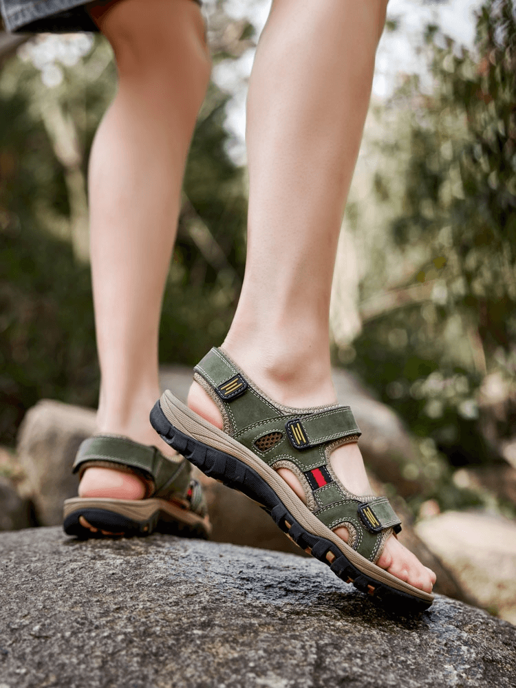 Open Toe Tactical Leather Men's Sandals with Adjustable Velcro straps, perfect for outdoor adventures, featuring a flat heel and solid style.