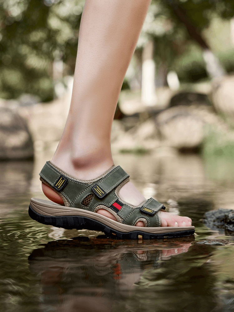 Open toe tactical leather men's sandals with adjustable Velcro crossing a stream, showcasing comfort and style. SF1101