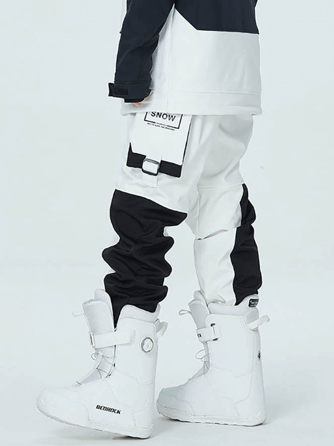 Stylish outdoor ski pants with elastic waistband and pockets, windproof and warm, perfect for winter sports. Model wearing white boots.