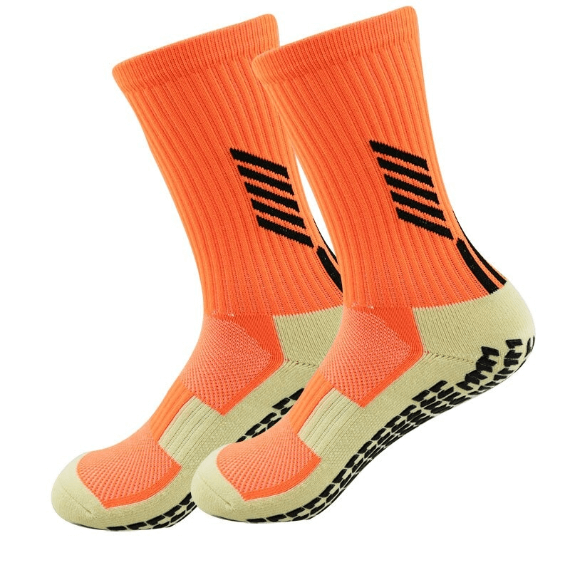 Bright orange football socks with silicone non-slip sole, knee-high design, made of nylon and spandex for comfort and durability.