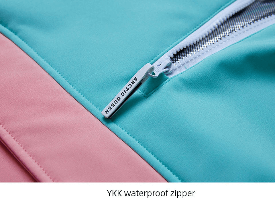 Close-up of a pink and teal jacket featuring a durable YKK waterproof zipper for enhanced protection against the elements.