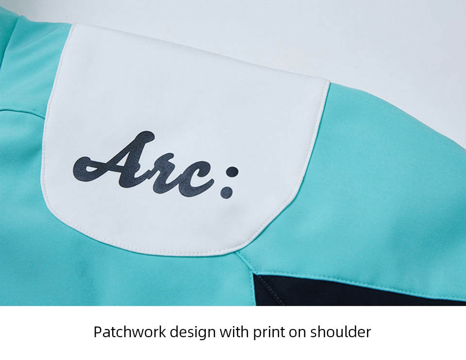 Close-up of a patchwork design with 'Arc:' print on shoulder of the snowboarding jacket.
