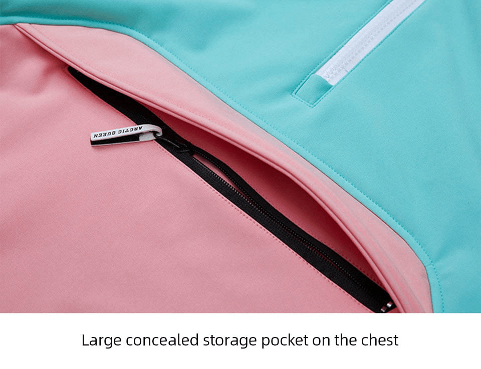 Close-up of the large, waterproof chest pocket on a snowboarding jacket, featuring a pink and blue design with a zipper.