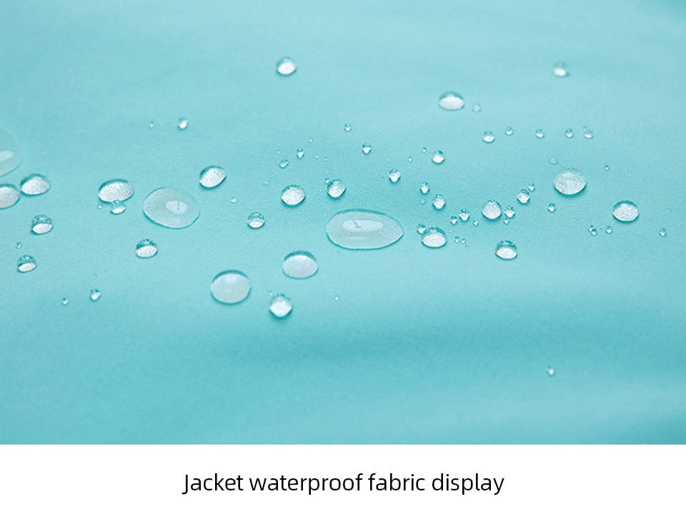 Close-up of waterproof fabric on an Outdoor Hood Snowboarding Jacket with water droplets visible, showcasing durability.