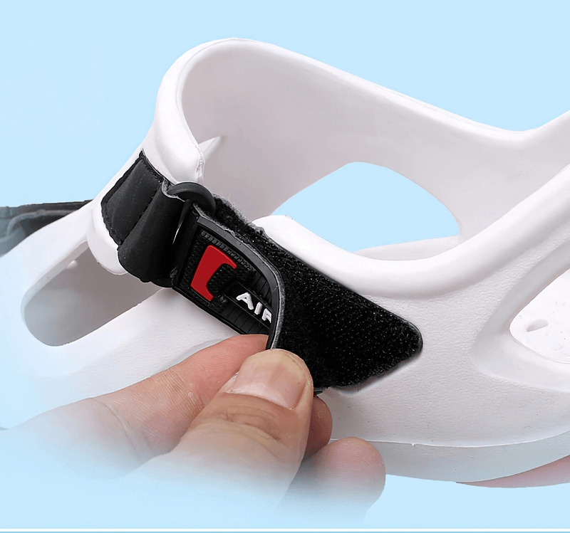 Close-up of outdoor men's water sandal with hook-and-loop fastener, showing secure hasp for easy wear. Stylish and durable design.