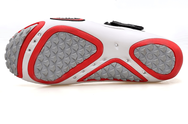Close-up of red and grey rubber outsole for men's water sandals SF0561, showcasing traction design for optimal grip and support.