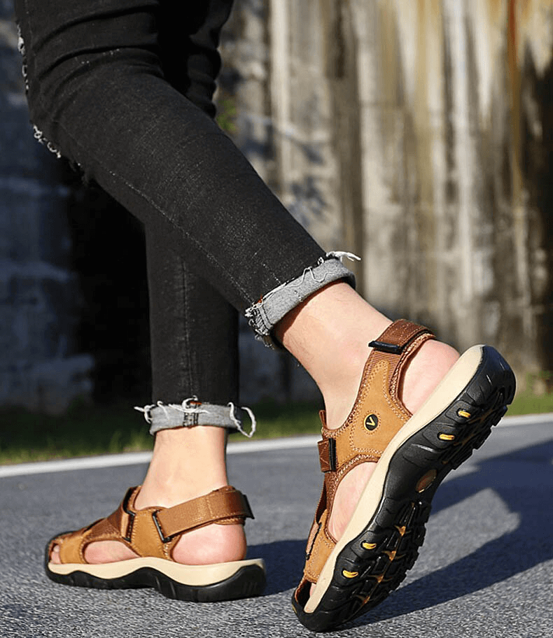 Outdoor mesh breathable sandals SF1097 with Velcro closure, ideal for active lifestyle; brown color, worn with jeans on pavement.