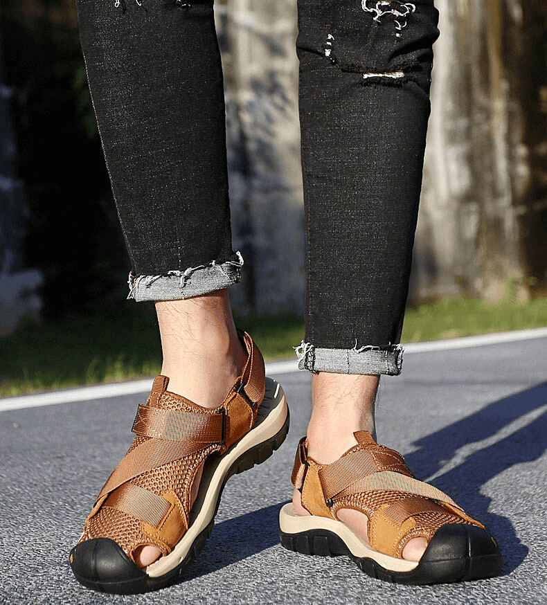 Outdoor mesh breathable sandals with Velcro closure, worn by a person walking on pavement, showcasing comfort and style. SF1097.