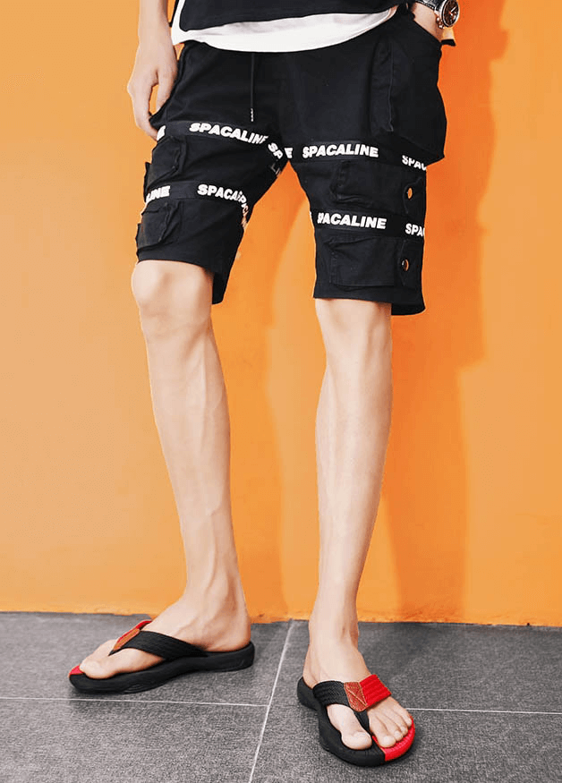 Stylish men's non-slip beach flip flops with thick soles, perfect for outdoor activities, featuring a sleek black and red design.