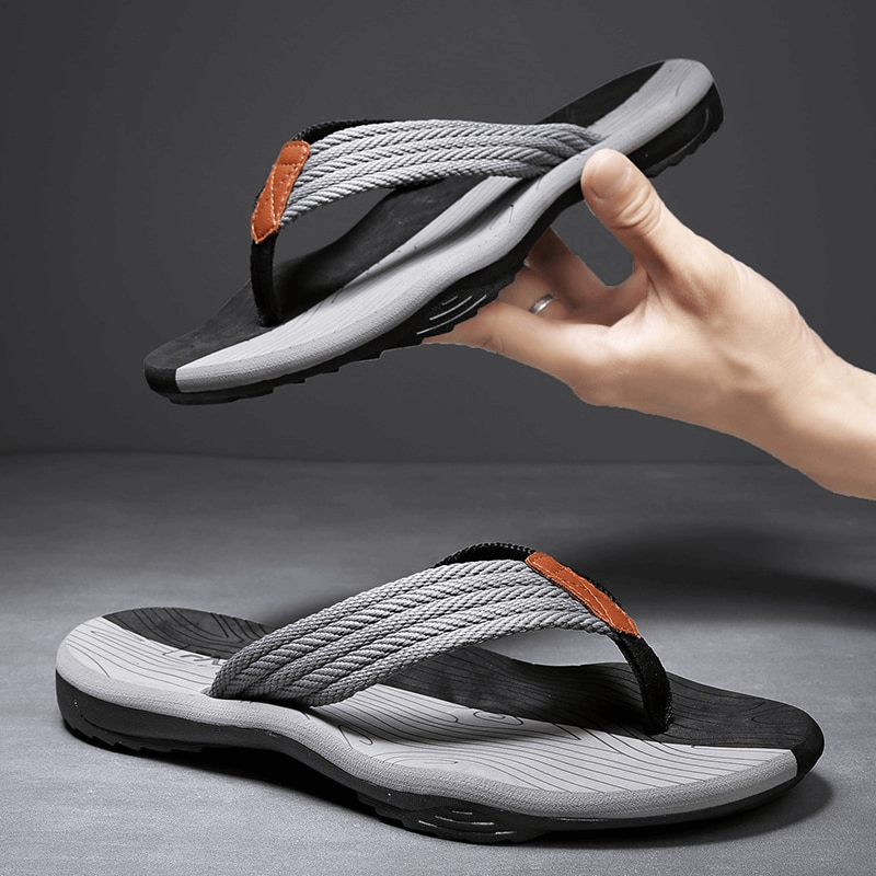 Gray non-slip beach flip flops for men with thick rubber sole and breathable straps, perfect for outdoor activities and comfort.