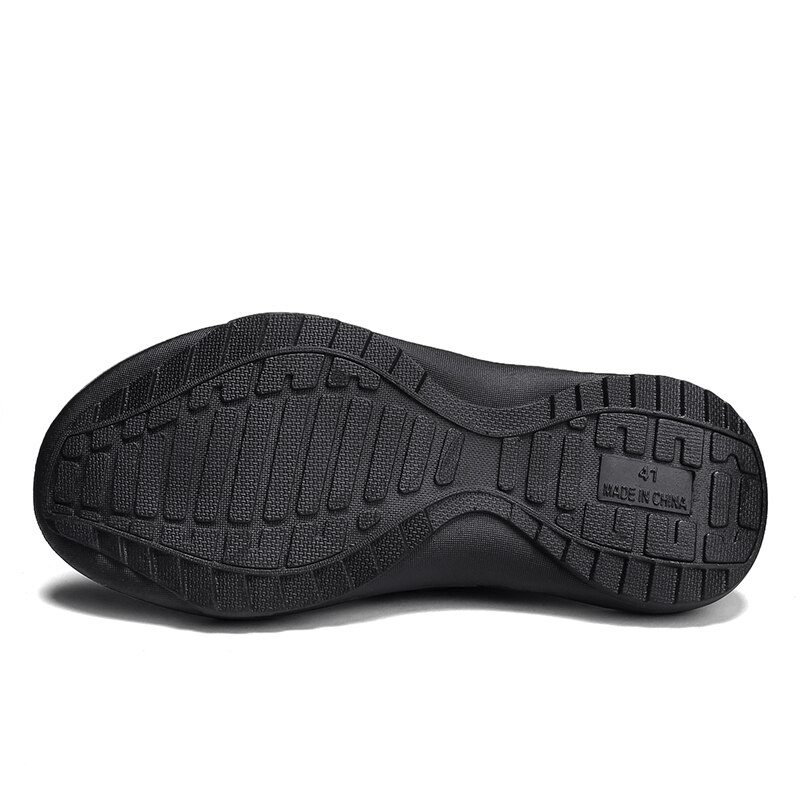 Durable non-slip rubber outsole of men's beach flip flops, designed for outdoor activities with maximum traction and stability.