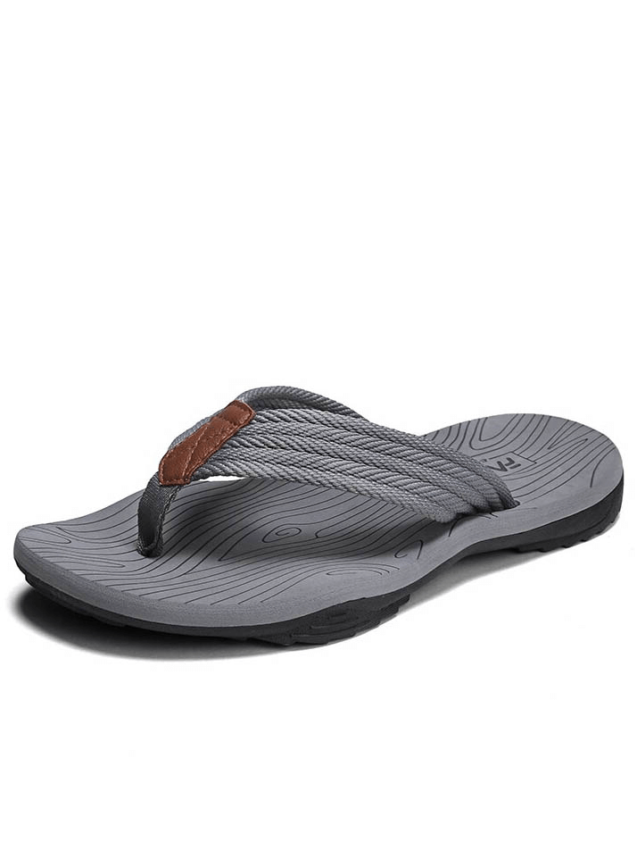 Outdoor non-slip thicken beach flip flops for men in grey with textured sole, providing traction and comfort for beach activities.