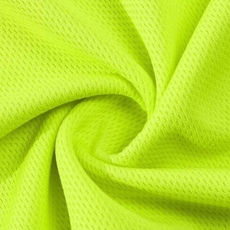 Close-up of breathable yellow polyester fabric from outdoor reflective vest, designed for visibility in cycling or running.