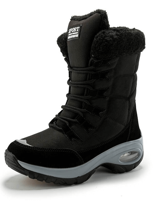 Stylish black outdoor snow boot for women, waterproof with warm interior, perfect for winter trekking and icy terrain.