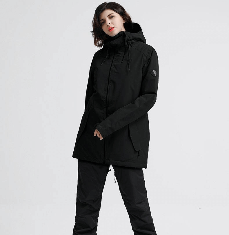 Woman wearing black outdoor snowboarding jacket, waterproof and windproof, perfect for skiing or winter activities, model SF0569.