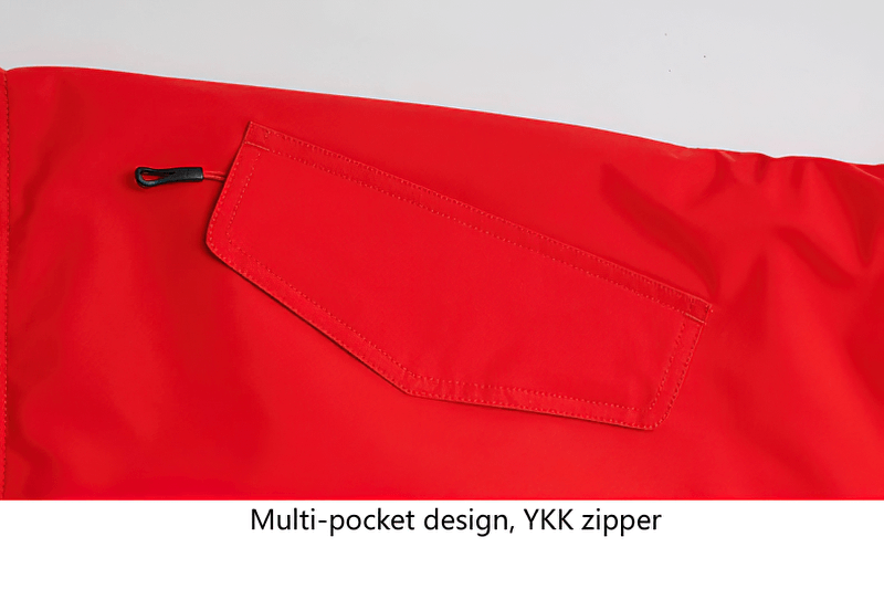 Close-up of red waterproof women's ski jacket featuring a multi-pocket design with YKK zipper, ideal for snowboarding and outdoor activities.