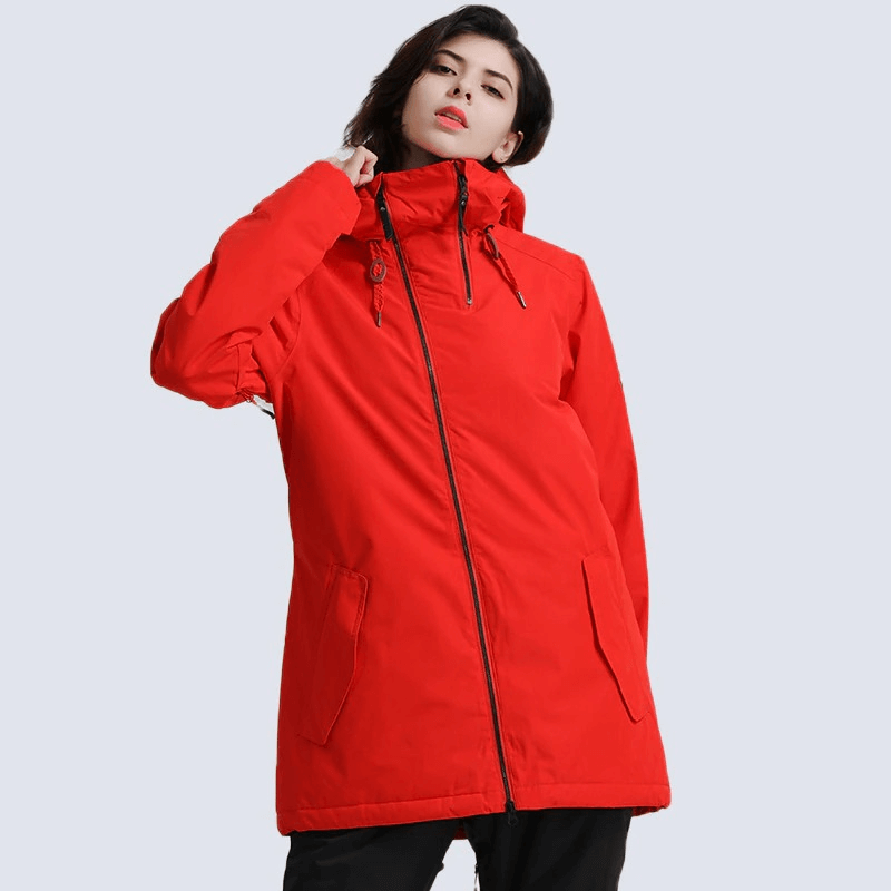 Women's red waterproof snowboarding jacket perfect for skiing, windproof and comfortable for outdoor winter activities.