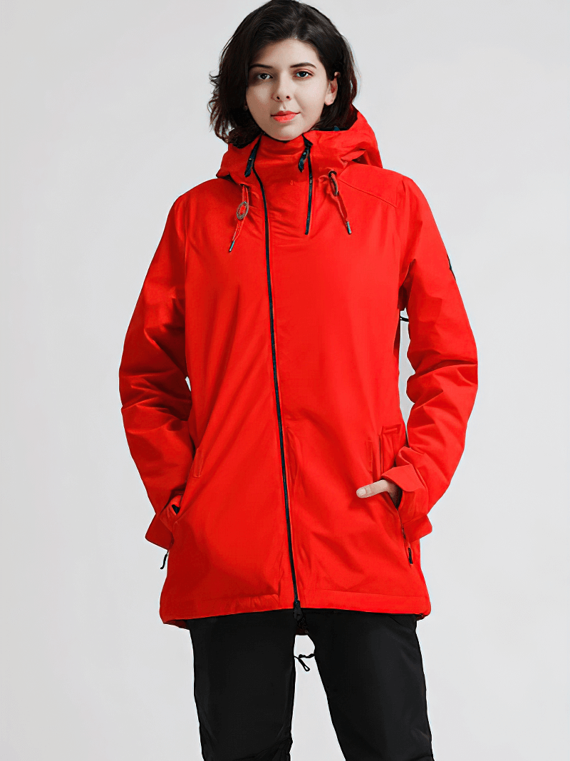 Woman wearing a red waterproof snowboarding jacket with hood, perfect for winter activities like skiing and snowboarding.
