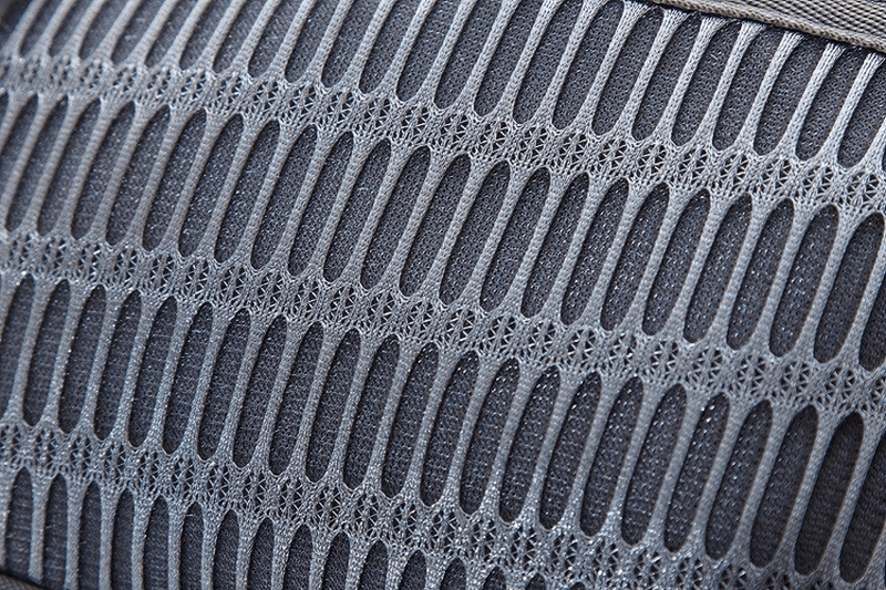 Close-up of durable nylon fabric detail on a running waist bag, highlighting breathable mesh design for outdoor sports.