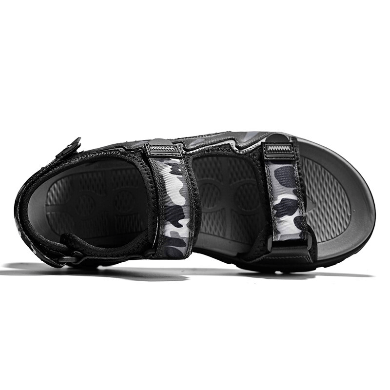 Top view of black ultralight men's sandals with camo accents, featuring soft sole and EVA outsole, perfect for outdoor adventures.