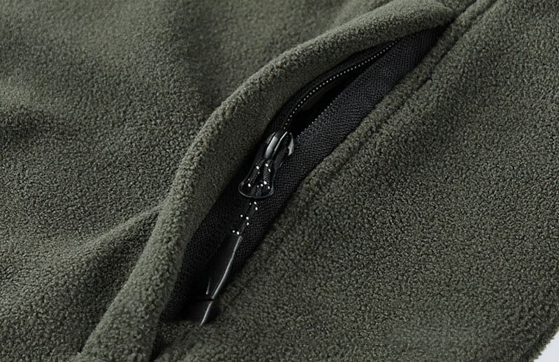 Close-up of the zipper on the Outdoor Zipper Fleece Hiking Jacket for men, featuring durable fleece material and inside pockets.