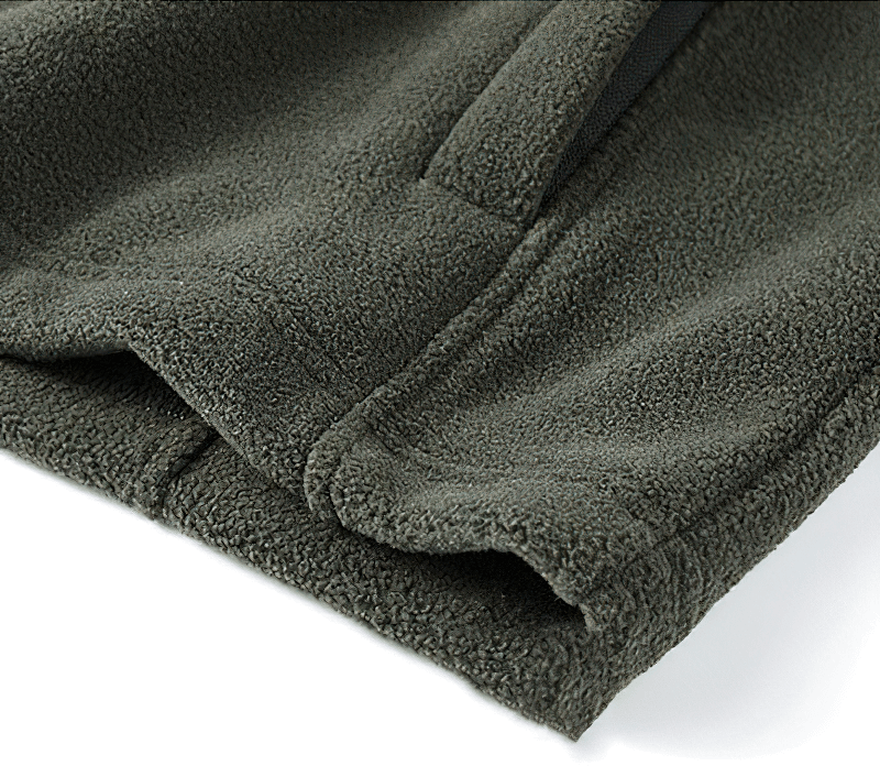 Close-up of green fleece fabric from men's outdoor hiking jacket SF0686, showing durable stitching and cozy texture.