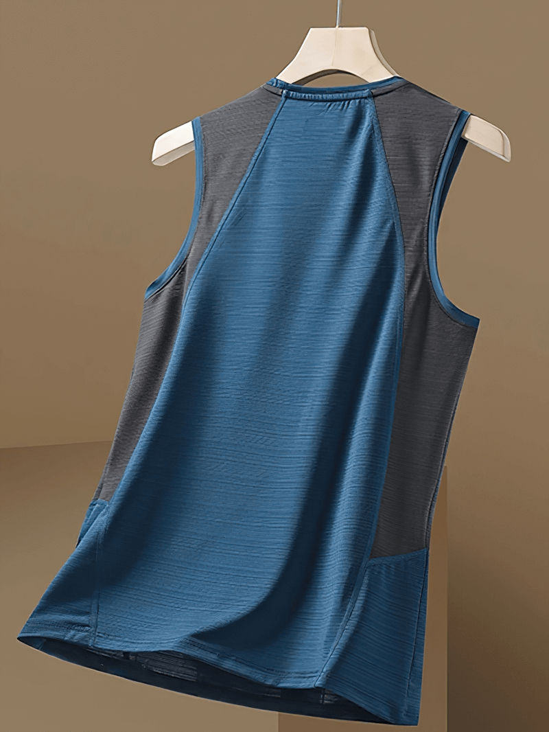 Men's patchwork tank top in blue and gray with an O-neck and elastic fit, perfect for gym and casual wear, hanging on a hanger.