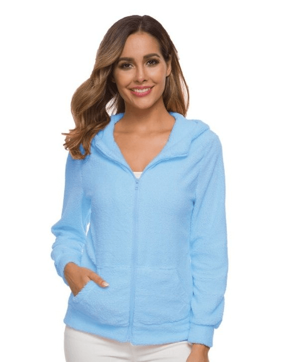 Woman modeling a light blue zip-up hooded fleece jacket with pockets, perfect for casual winter wear.