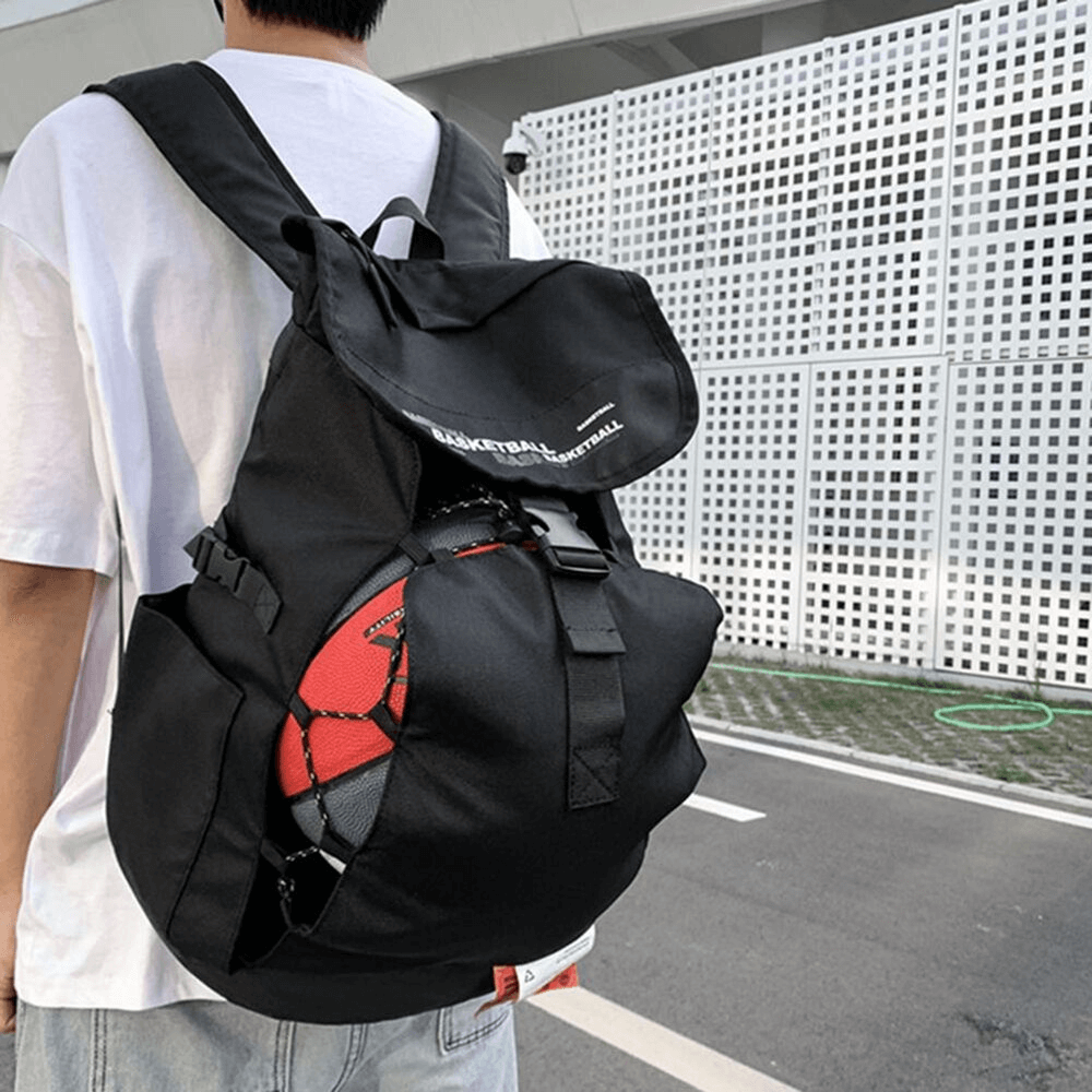 Unisex portable sports basketball bag with ball pocket, worn by a person, outdoor backpack made of durable Oxford Cloth, black color.