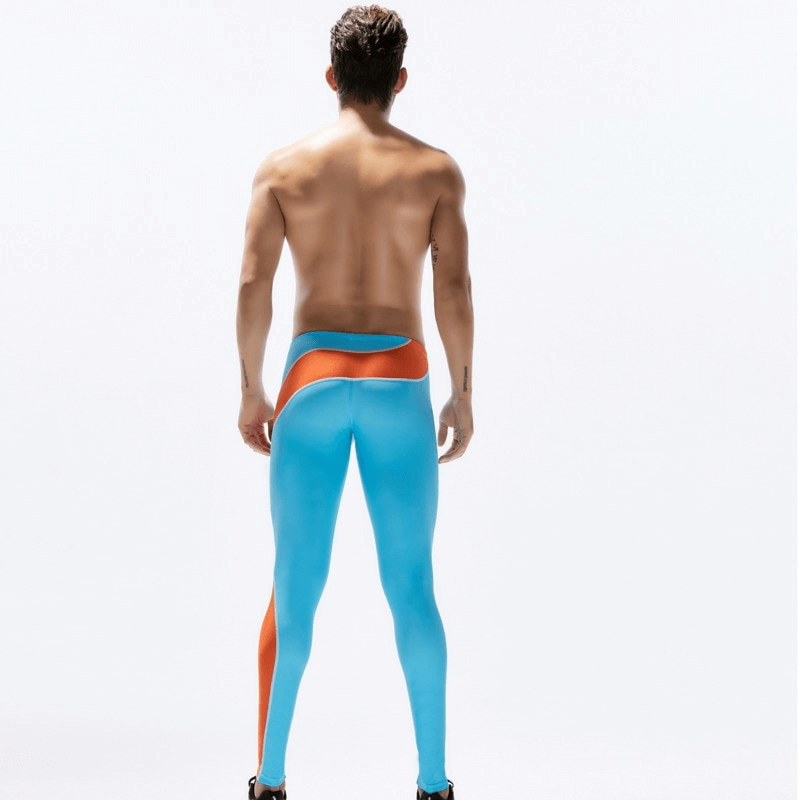Back view of a man wearing blue and orange quick-drying compression running leggings, highlighting breathable fit and muscle support.