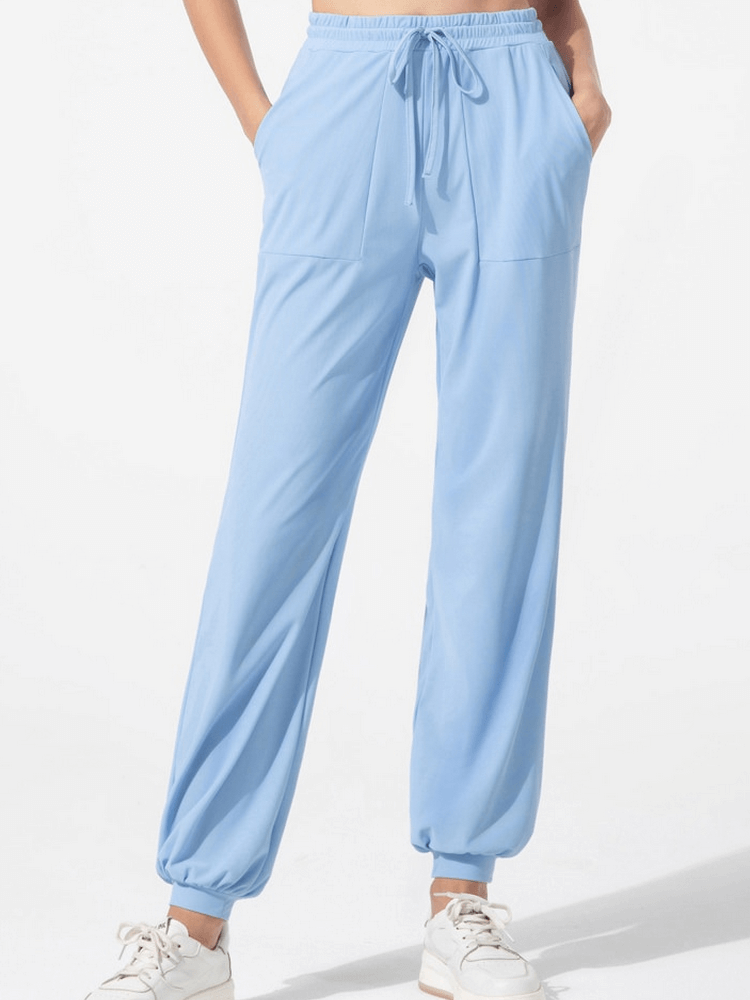 Quick-drying women's blue training pants with drawstring and pockets, perfect for yoga and sports activities, SF1262.