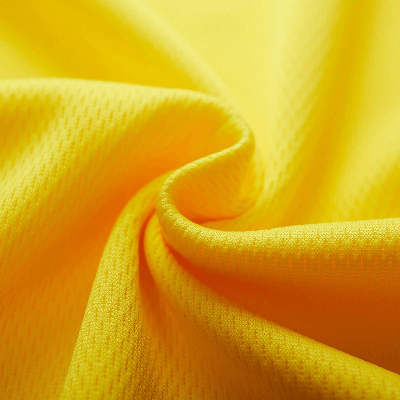 Close-up of yellow polyester quick-drying sports fabric for men's short-sleeved T-shirt SF0466, showing moisture-wicking texture.