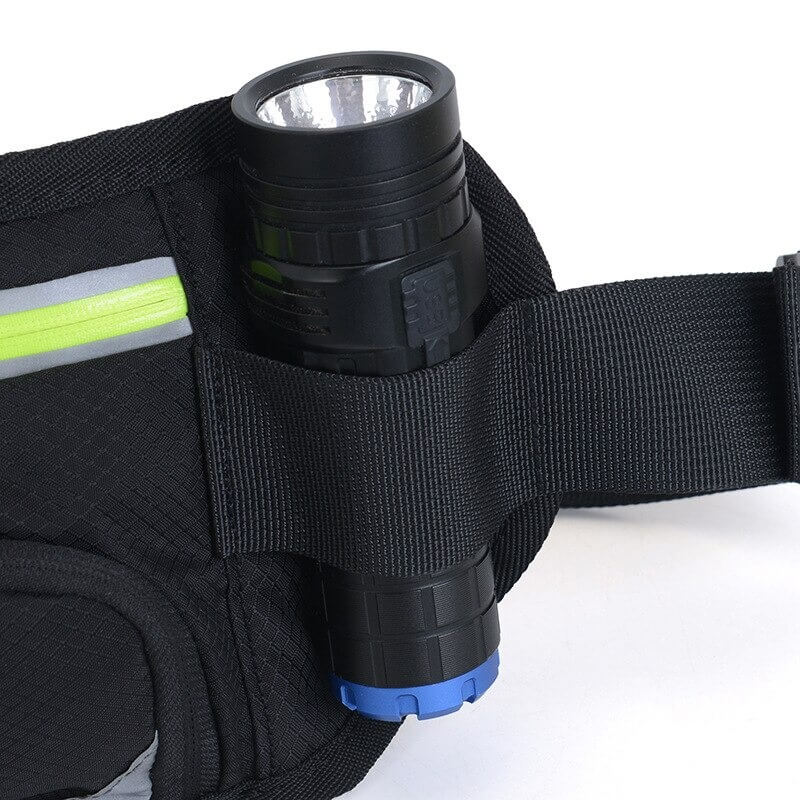 Close-up of black running belt bag with flashlight holder and neon detail, perfect for gym and outdoor activities.
