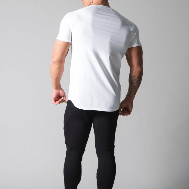 Back view of a man wearing a white cotton running t-shirt with striped sleeves, paired with black pants. Ideal for stylish comfort and performance.