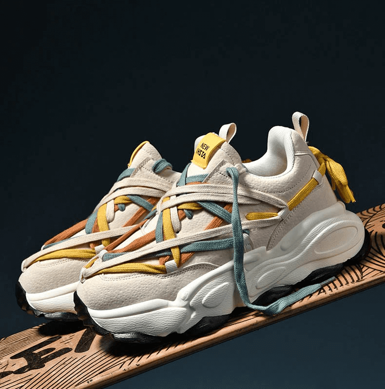 Stylish running sneakers with thick bottoms and multicolored laces, perfect for stability, comfort, and fashion-forward explorers.