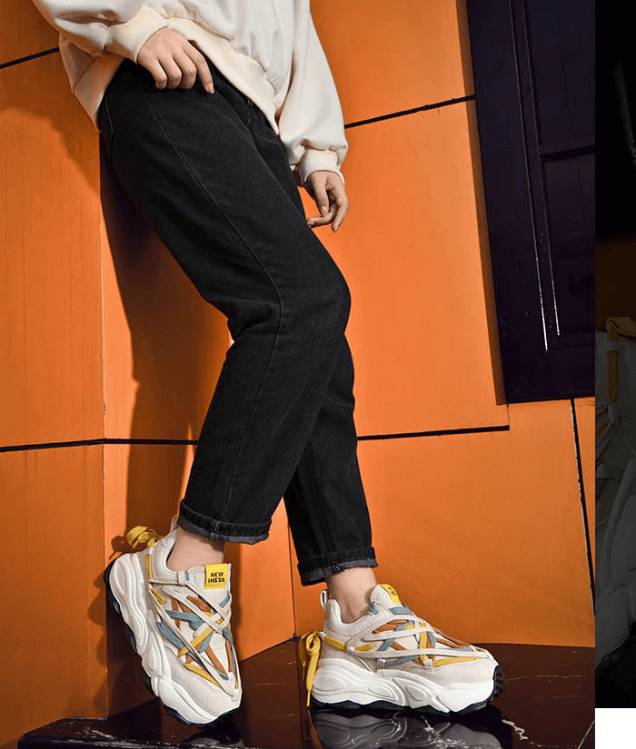 Stylish thick bottom leather sneakers with colorful laces, perfect for stability and performance, modeled indoors. SF0375