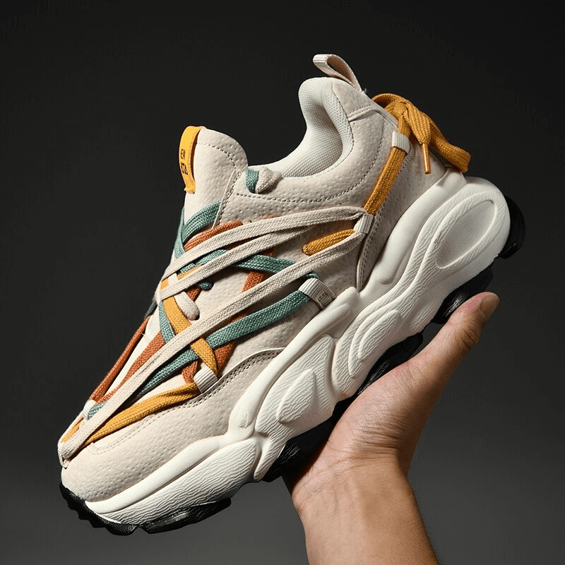 Running thick bottom leather sneaker with colorful laces held against dark background; cushioned, waterproof, unisex design, SF0375.