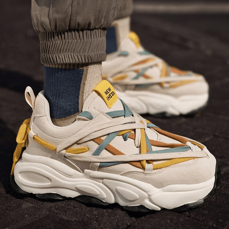 Running thick bottom leather sneakers with multicolored laces, featuring a cushioned EVA outsole, showcased on a dark surface. SF0375