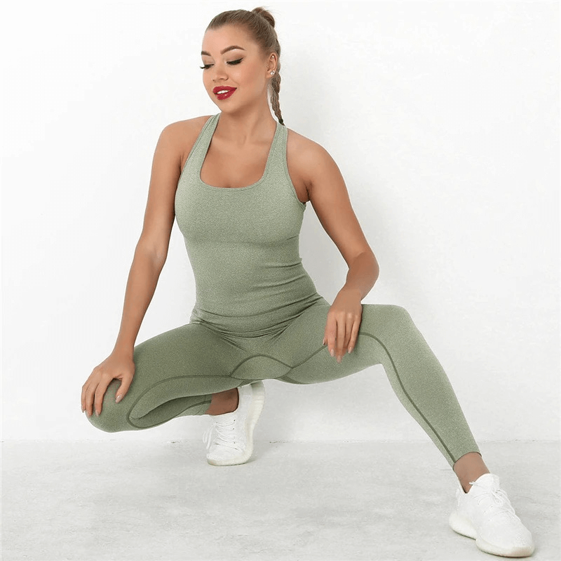 Woman wearing seamless high waist bodysuit, performing a stretch, showcasing gym wear with hip push-up feature in green.