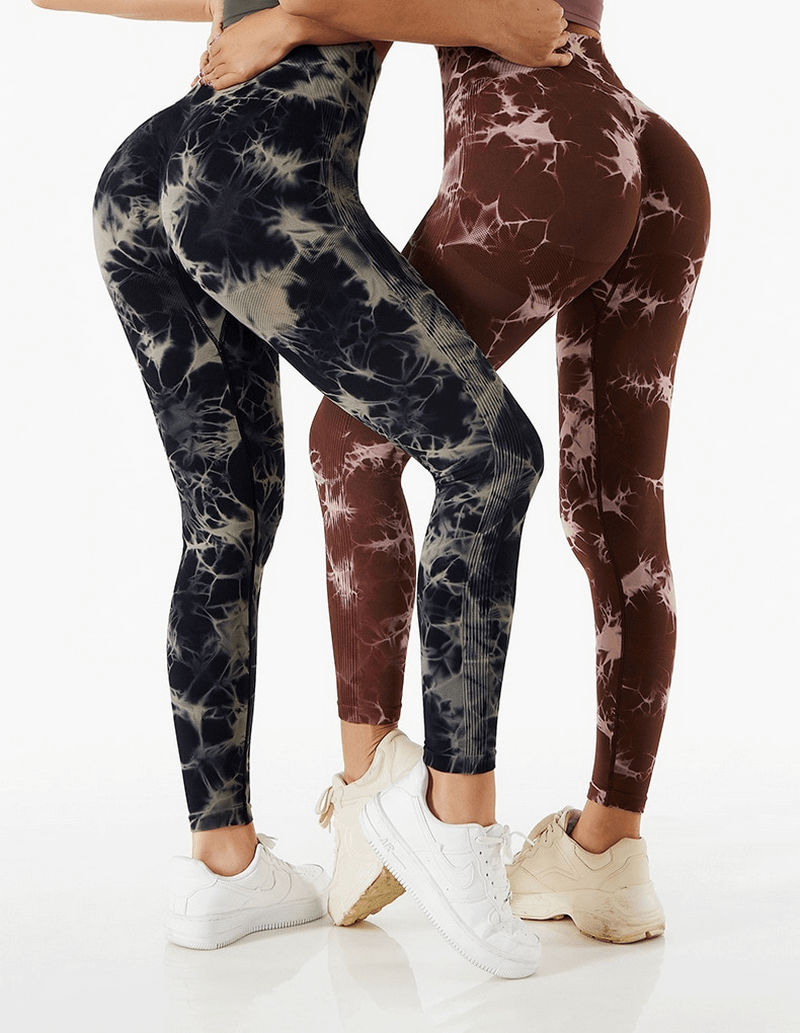 Women wearing tie-dye pattern seamless high waist leggings, perfect for fitness and yoga activities.