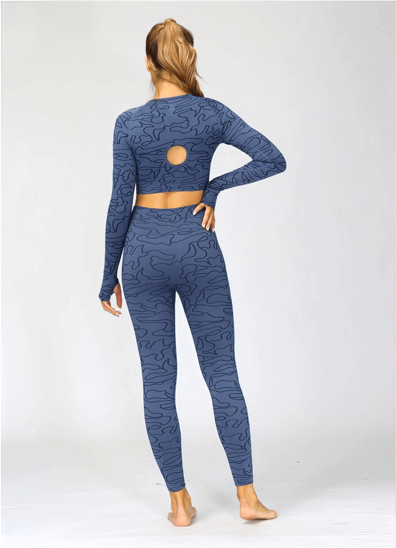 Woman wearing a blue seamless long-sleeve crop top and leggings for sports, showing the back design.