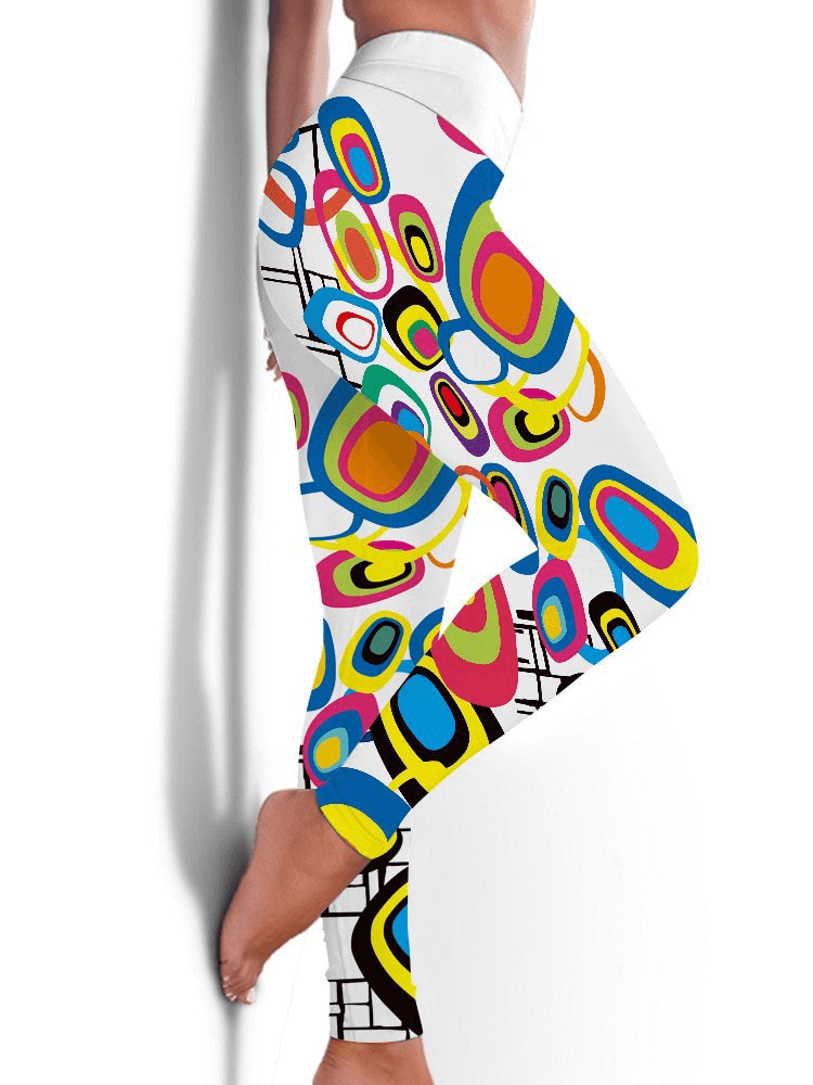 Woman wearing seamless printed elastic workout leggings with colorful abstract design, perfect for yoga or running, full-length fit.