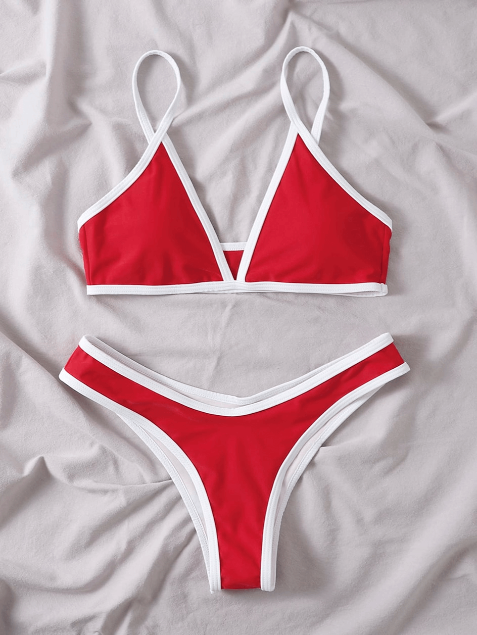 Red micro bikini with adjustable straps, featuring wire-free support and high waist design for women. Ideal for beach outings.