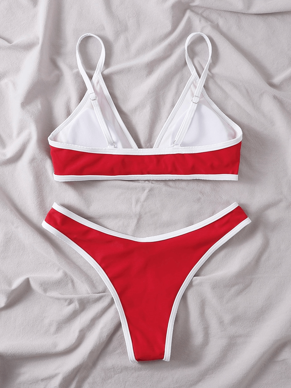 Sexy adjustable red micro bikini set with white trim for women. Perfect swimwear for beach, featuring wire-free support and comfort.